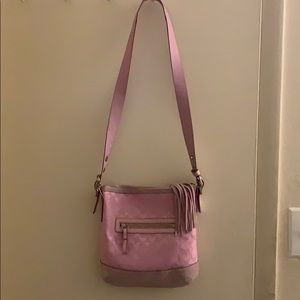 A Coach bag. Crossbody strap.